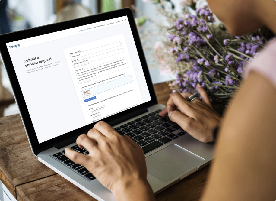 Person on laptop submitting a MyHome service request.